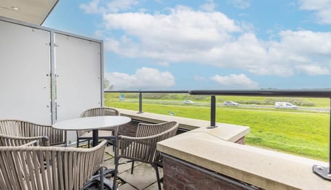 Sip morning coffee on the private balcony seating.