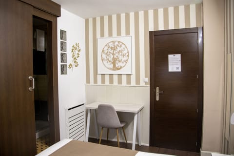 Double or Twin Room | Desk, blackout drapes, iron/ironing board, free WiFi