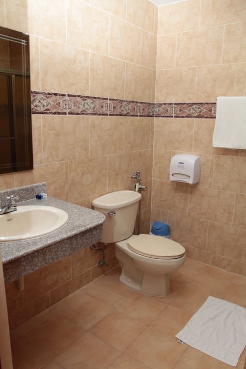 Double Room, 2 Double Beds | Bathroom | Shower, hair dryer, towels