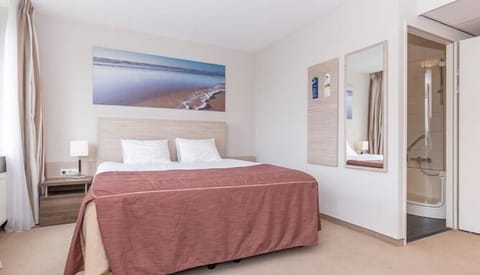 Unwind into crisp linens after a day of exploring.
