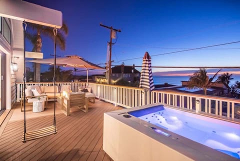 Enjoy the firepit, spa and swing while admiring the ocean views.
