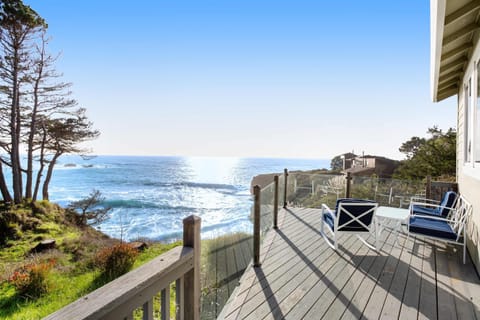Gaze out over the endless blue from your private deck, where the ocean's rhythm invites you to relax and soak in the stunning coastal views.