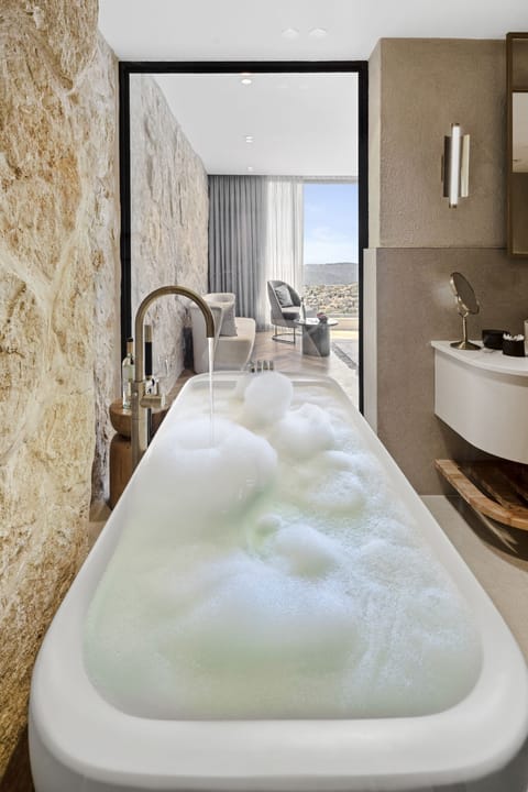 Junior Suite, Mountain View | Bathroom | Separate tub and shower, free toiletries, hair dryer, bathrobes