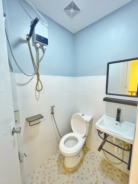 Economy Double Room (With Fan) | Bathroom | Shower, rainfall showerhead, towels