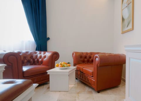 Executive Room | Living area | Flat-screen TV, heated floors