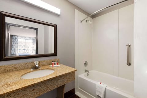 Combined shower/tub, hair dryer, towels, soap