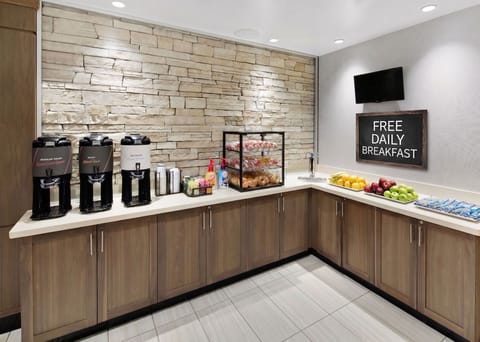Complimentary breakfast area with fresh hot and cold selections.
