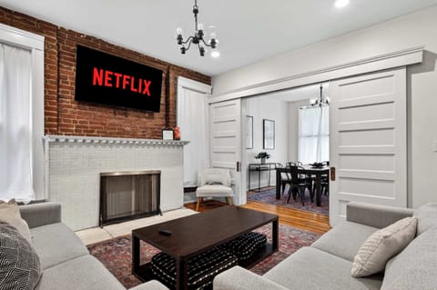 Living Room: Sink into the sectional, flip on the NETFLIX sign, and let movie night officially begin.