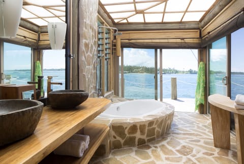 Bungalow, Overwater (Fale) | Bathroom | Shower, free toiletries, hair dryer, towels