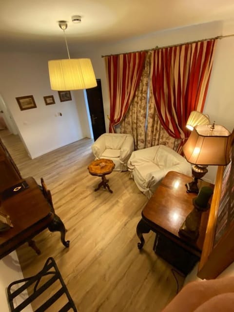 Comfort Villa (3 meters from main building) | Living area | Flat-screen TV, books