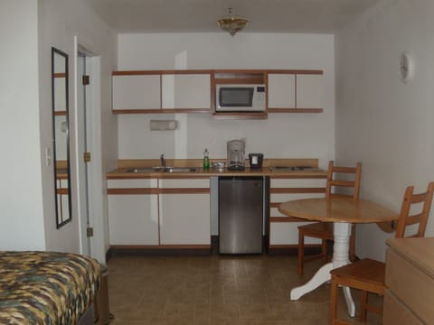 Double Queen Room (Pet Friendly) | Private kitchenette | Fridge, microwave, stovetop, coffee/tea maker