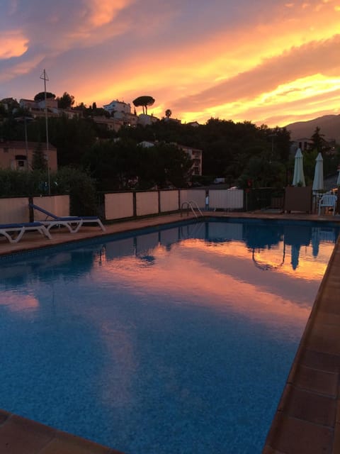 Outdoor pool, open 7:00 AM to 11:00 PM, sun loungers