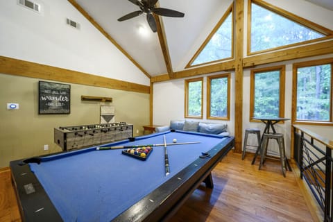 The expansive game loft features a pool table and foosball for hours of entertainment.