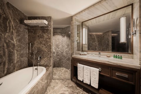 Premier Room, 1 King Bed | Bathroom | Combined shower/tub, deep soaking tub, designer toiletries, hair dryer