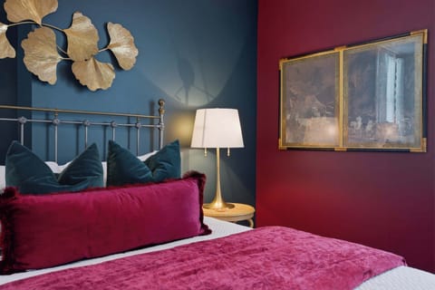 The bedroom retreat features a plush queen-sized bed​
