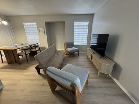 Relax in this cozy lounge area featuring a plush sofa and stylish décor.