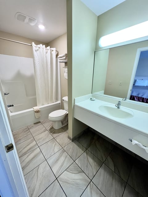 Deluxe Room, 2 Queen Beds, Patio, Courtyard Area | Bathroom | Free toiletries, hair dryer, towels