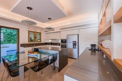 Villa | Private kitchen | Fridge, microwave, oven, stovetop