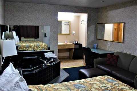 Standard Suite, 1 King Bed, Jetted Tub (Smoking) | Iron/ironing board, free WiFi, alarm clocks