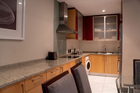 Suite, 1 Bedroom | Private kitchen | Fridge, microwave, oven, stovetop