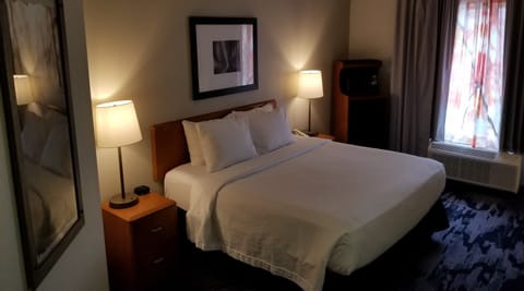 Room, 1 King Bed, Pool Access | Laptop workspace, blackout drapes, iron/ironing board