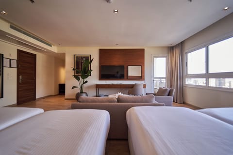 Deluxe Family Room | 2 bedrooms, minibar, in-room safe, desk