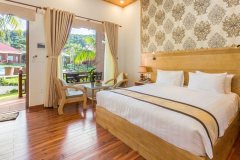 Deluxe Bungalow, 1 King Bed, Pool View | Minibar, in-room safe, desk, blackout drapes