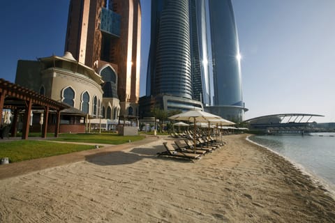 Private beach, white sand, sun loungers, beach umbrellas