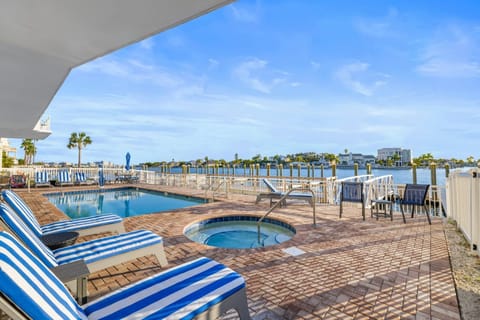 Relax by the pool and soak up the sun with a refreshing drink in hand. A perfect spot to unwind.