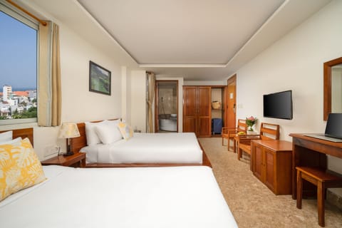 Deluxe Triple Room, City View | Minibar, in-room safe, individually decorated, individually furnished
