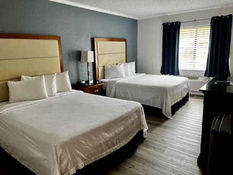 Deluxe Room, 2 Queen Beds (Interior) | In-room safe, iron/ironing board, rollaway beds, bed sheets