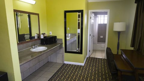 Room, 2 Queen Beds, Smoking, Microwave | Bathroom | Combined shower/tub, free toiletries, towels