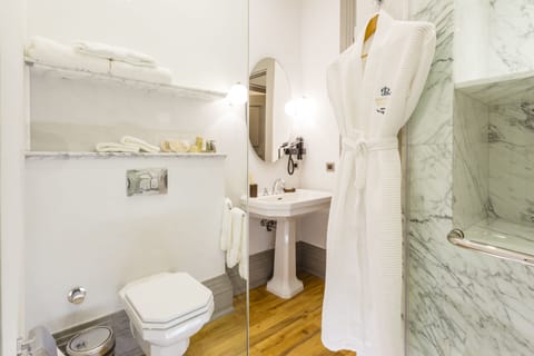 Deluxe Room, City View | Bathroom | Shower, designer toiletries, hair dryer, bathrobes