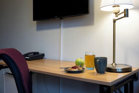 Single Room | Minibar, blackout drapes, iron/ironing board, free WiFi