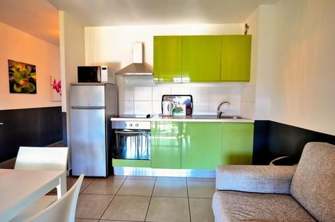 Classic Apartment, 1 Bedroom | Private kitchen | Fridge, microwave, stovetop, highchair