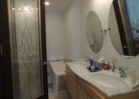 Luxury Suite, 1 King Bed, Private Bathroom (Michael Angelo) | Bathroom | Rainfall showerhead, designer toiletries, hair dryer, towels