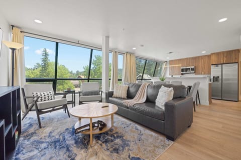 Enjoy this modern living room with a beautiful view of Evergreen! 