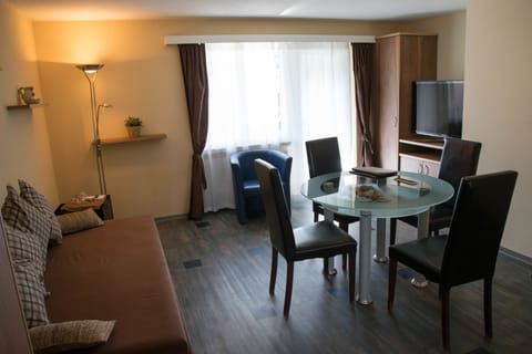 Suite, 2 Bedrooms | Living room | 43-inch flat-screen TV with cable channels, TV