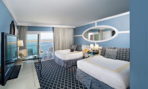 Room with Two Double Beds and Partial Ocean View | Down comforters, minibar, in-room safe, desk