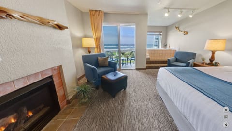 Room, 1 King Bed, Balcony, Oceanfront (Fireplace & Jacuzzi) | Living room | TV, DVD player, books, video library