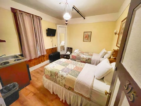 Economy Twin Room, Shared Bathroom | Blackout drapes, free WiFi, bed sheets