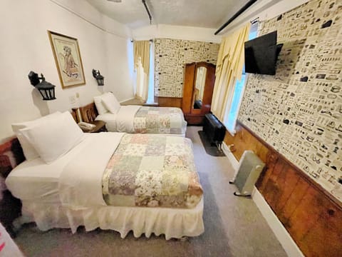 Economy Twin Room, Shared Bathroom | Blackout drapes, free WiFi, bed sheets