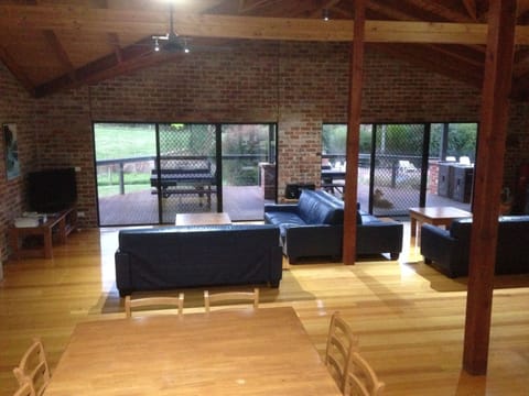 Group Lodge (4 Queen, 2 Single and 5 Bunk Bed), 4 Bedrooms, Pool View | Living area | LED TV, DVD player