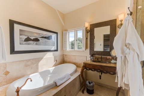 Standard Room, 1 King Bed, Courtyard Area | Bathroom | Hair dryer, bathrobes, slippers, towels