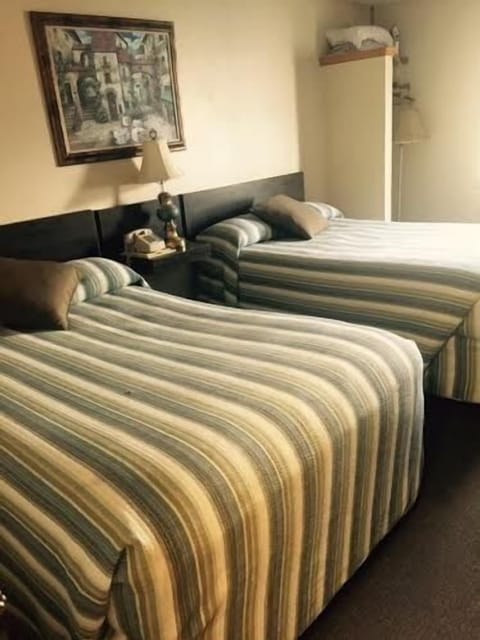 Standard Double Room, 2 Double Beds | Iron/ironing board, free WiFi, bed sheets