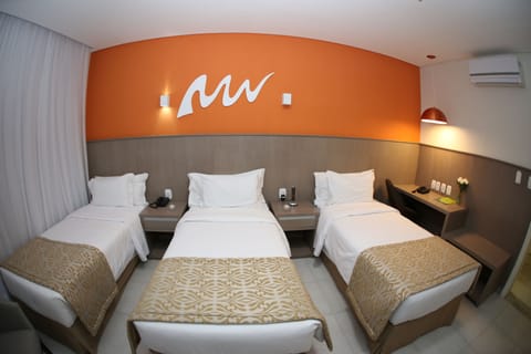 Deluxe Triple Room | Minibar, in-room safe, desk, free WiFi