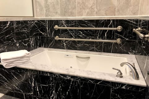 Deluxe King ADA | Bathroom | Separate tub and shower, deep soaking tub, free toiletries, hair dryer