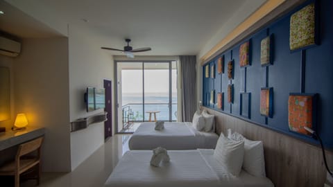 Deluxe Double or Twin Room, Balcony, Oceanfront | Minibar, in-room safe, desk, blackout drapes