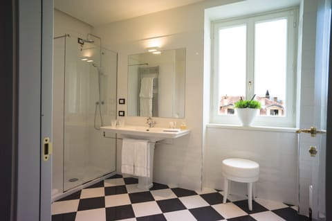 Quadruple Room | Bathroom | Shower, free toiletries, hair dryer, bathrobes