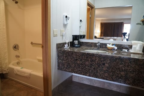Deluxe Double Room (with Sofa) | Bathroom | Combined shower/tub, hair dryer, towels